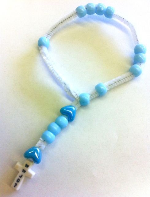 teaching rosary for kids made with blue pony beads and a white pipe cleaner