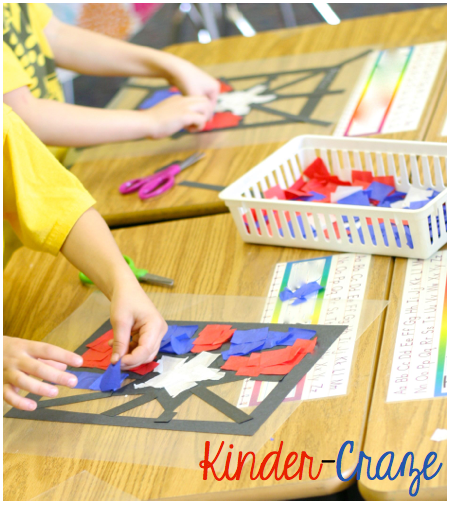 kindergarten children working at desks to create red, white and blue 4th of july window craft