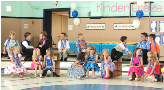 kindergarten students seated on stage risers for graduation ceremony