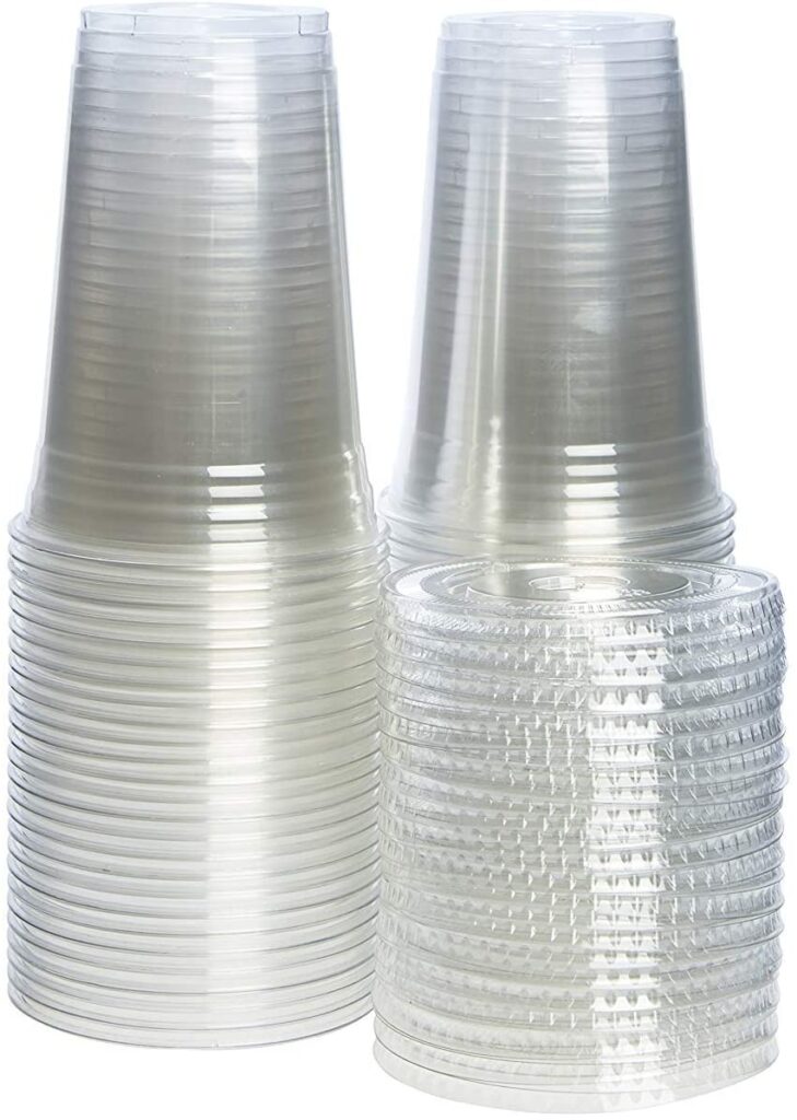stacks of clear plastic cups with lids