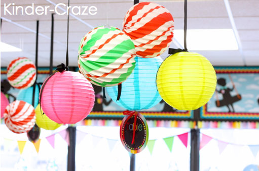 green, white, and red striped paper Christmas lanterns decorating classroom for class party