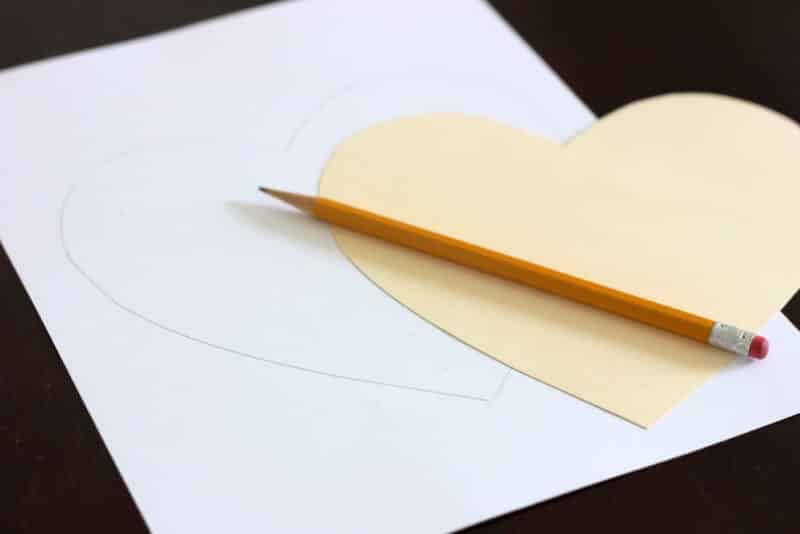 tracing heart template onto blank white cardstock