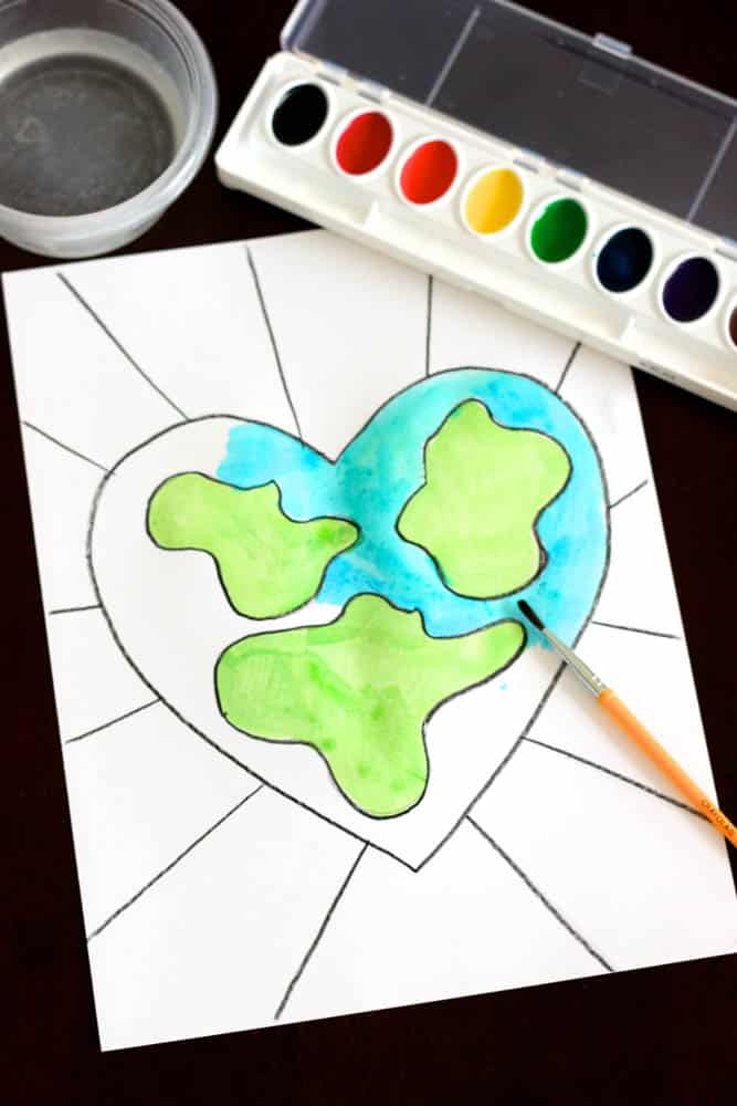 earth day art project of a heart-shaped earth painted with watercolor paints