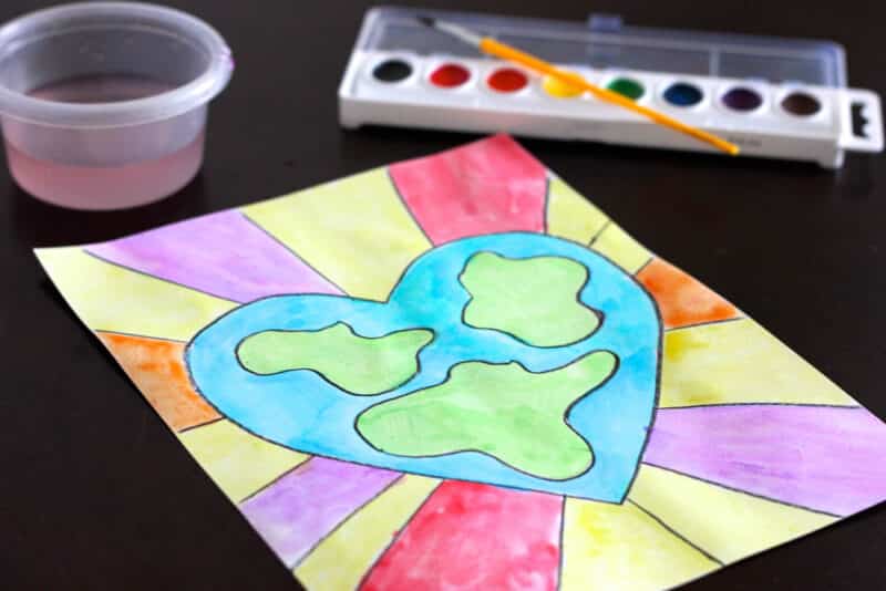 kids watercolor painting of a heart-shaped earth