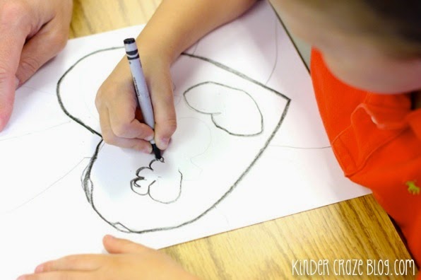 child drawing earth shaped like a heart