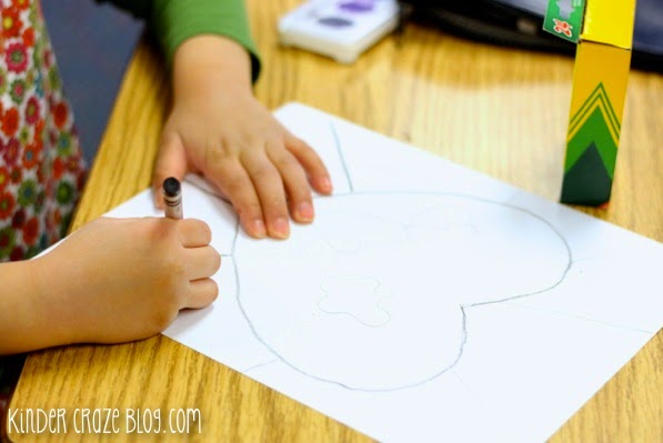 child drawing heart shaped earth art project