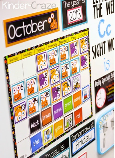 kindergarten classroom calendar display set up for the month of october with calendar numbers, holiday cards, days of the week, year, counting days of school, and color day reminder cards