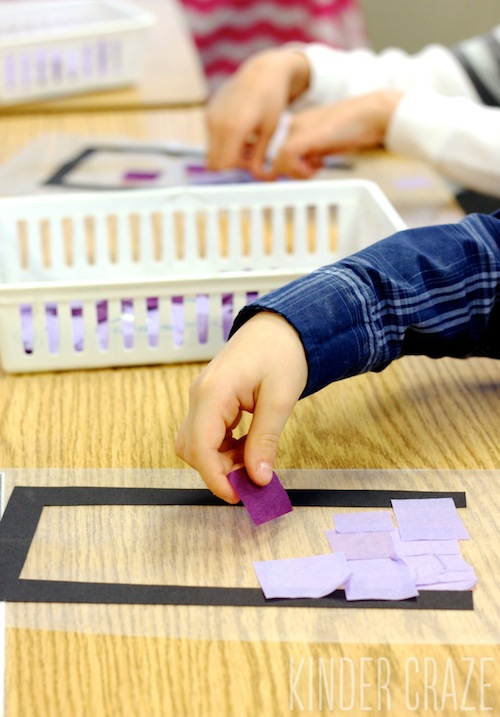kindergarten student presses purple tissue paper squares onto clear contact paper to make stained glass decoration