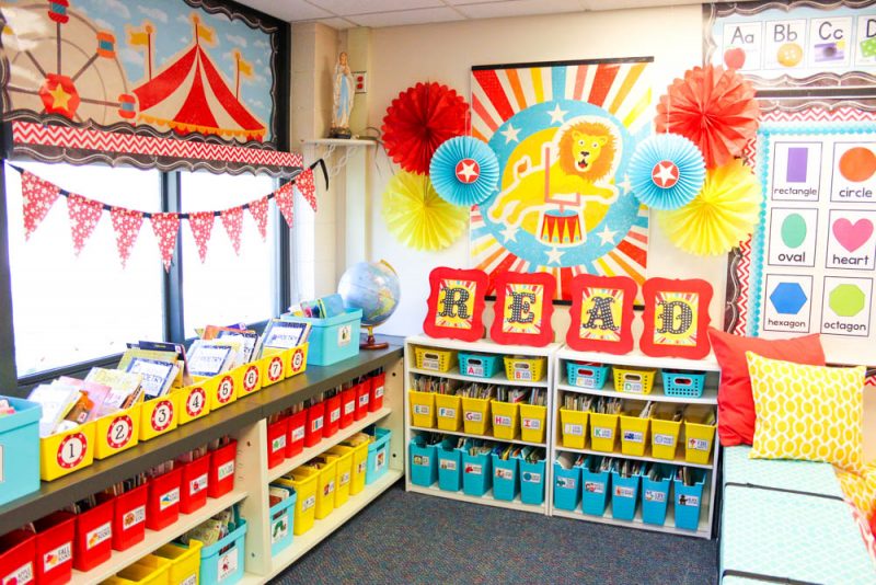A beautifully organized classroom library with shelves filled with colorful books and labeled bins. The books are neatly arranged and sorted by genre, creating an inviting and engaging reading space for students.