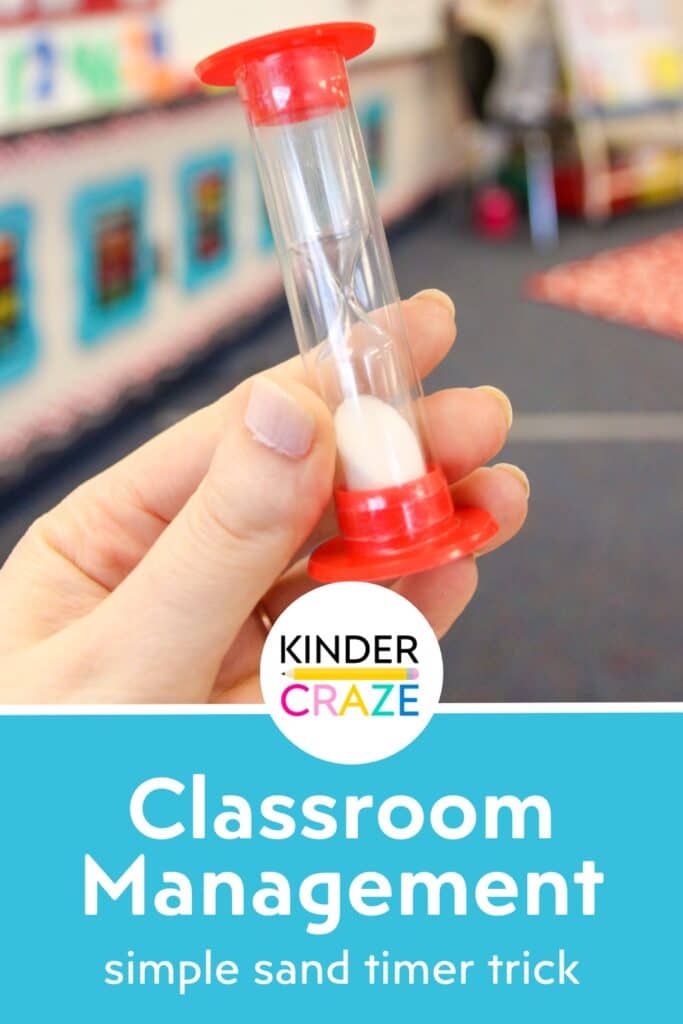 teacher holding a red sand timer in a kindergarten classroom with the text "classroom management simple sand timer trick"