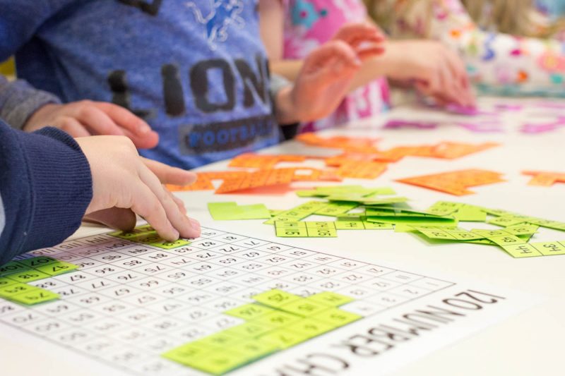 Using number puzzles to build number sense up to 120 with Astrobrights paper | Kinder Craze teaching blog