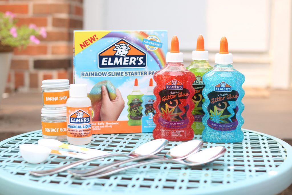Elmers Rainbow slime kit with ingredients laid out to make your own rainbow slime